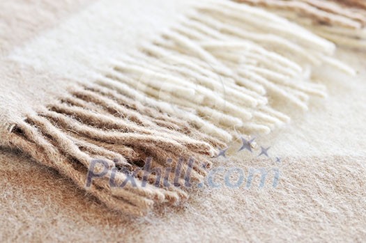 Soft and warm folded alpaca wool blanket with fringe Soft and warm folded alpaca wool blanket with fringe