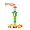 Hand building tower of wooden blocks isolated on white background