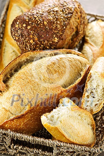 Various kinds of fresh baked bread in basket Various kinds of fresh baked bread in basket