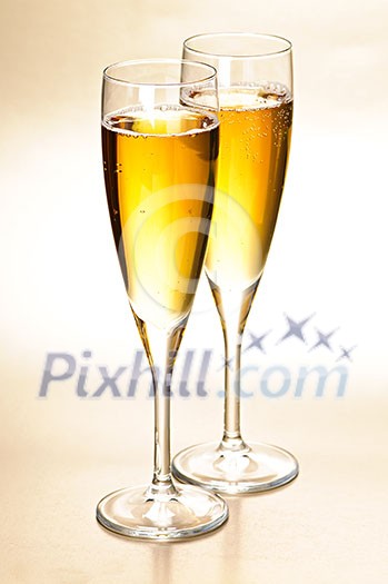 Two full champagne flutes with sparkling wine Two full champagne flutes with sparkling wine