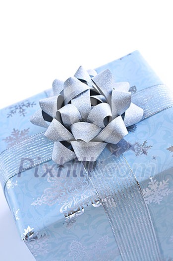 Wrapped christmas gift box close up on white background Wrapped christmas gift box close up on white background