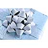 Wrapped christmas gift box close up on white background