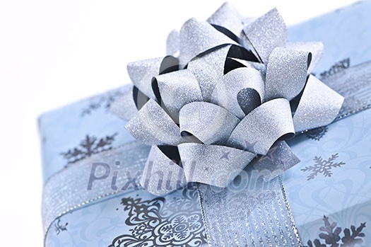 Wrapped christmas gift box close up on white background Wrapped christmas gift box close up on white background