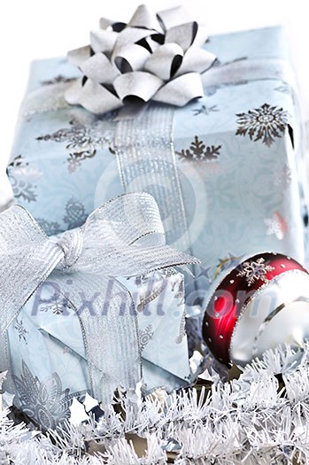 Two gift boxes with Christmas ornaments on white background Two gift boxes with Christmas ornaments on white background