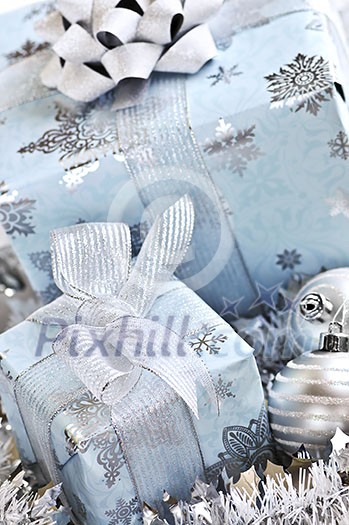 Wrapped gift boxes with silver Christmas ornaments Wrapped gift boxes with silver Christmas ornaments