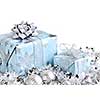 Wrapped gift boxes with silver Christmas ornaments on white background