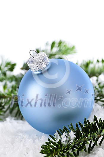Blue Christmas decoration in snow with pine branches Blue Christmas decoration in snow with pine branches