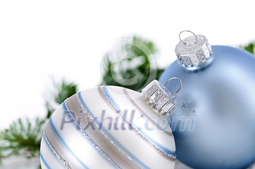 Two Christmas decorations in snow with pine branches Two Christmas decorations in snow with pine branches