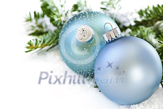 Two Christmas decoration in snow with pine branches Two Christmas decoration in snow with pine branches