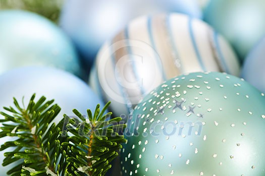 Many Christmas decorations laying in pine branches Many Christmas decorations laying in pine branches