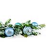 Many Christmas decorations laying in pine branches and snow