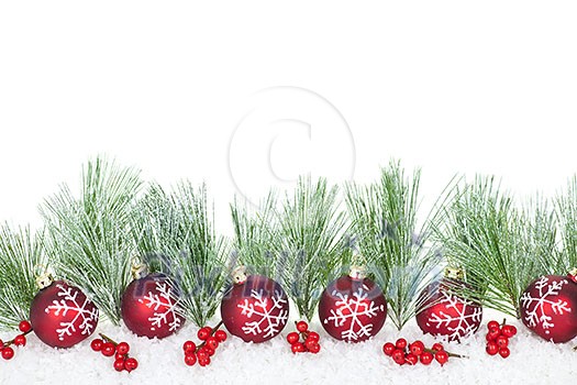 Christmas border with red ornaments and pine branches