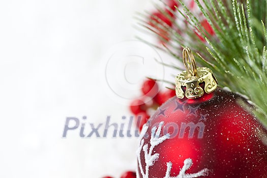 Red Christmas decoration with pine needles with copy space Red Christmas decoration with pine needles with copy space