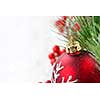 Red Christmas decoration with pine needles with copy space