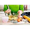 Mixing ingredients for baking cookies in glass bowl