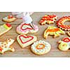 Decorating homemade shortbread cookies with icing from piping bag