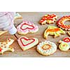Decorating homemade shortbread cookies with icing from piping bag