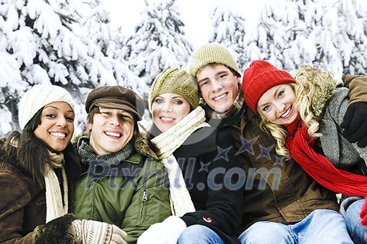 Group of diverse young friends outdoors in winter Group of diverse young friends outdoors in winter