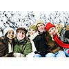 Group of diverse young friends outdoors in winter