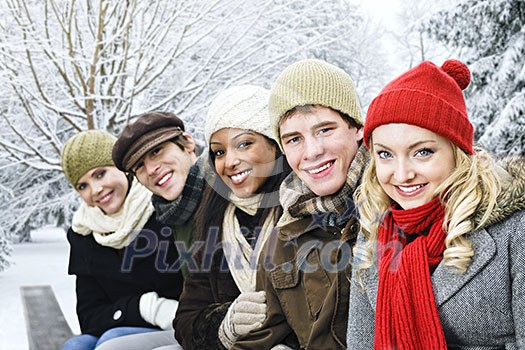 Group of diverse young friends outdoors in winter Group of diverse young friends outdoors in winter