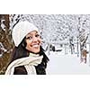 Portrait of happy woman outdoors in winter