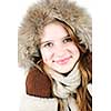 Portrait of beautiful young woman in fur hood of winter coat