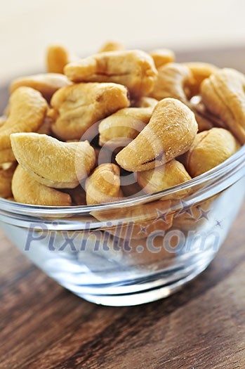 Close up of cashew nuts in glass bowl Close up of cashew nuts in glass bowl