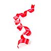 Curled red holiday ribbon strip isolated on white background