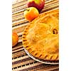Whole apple pie with apples close up