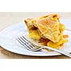 Slice of fresh apple pie on a plate