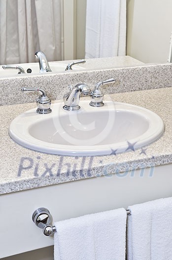 Bathroom interior with white sink, faucet and mirror Bathroom interior with white sink, faucet and mirror