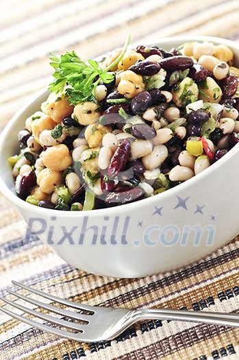 Vegeterian salad of various beans in bowl close up
