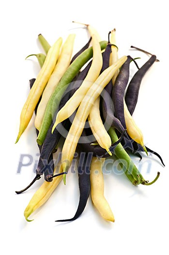 Pile of purple yellow and green string beans isolated on white Pile of purple yellow and green string beans isolated on white