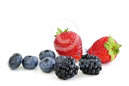 Closeup of assorted fresh berries isolated on white background Closeup of assorted fresh berries isolated on white background