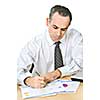Serious office worker reviewing generic reports at his desk