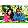 Young romantic couple enjoying summer day in park