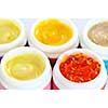 Colorful jars of skin care creams and lotions