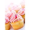 Lots of tasty cupcakes with icing and sprinkles