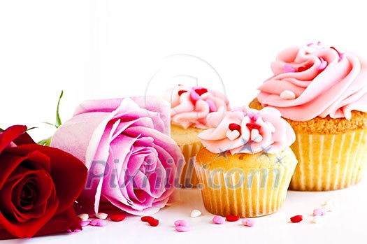 Valentines day roses and cupcakes with pink icing Valentines day roses and cupcakes with pink icing