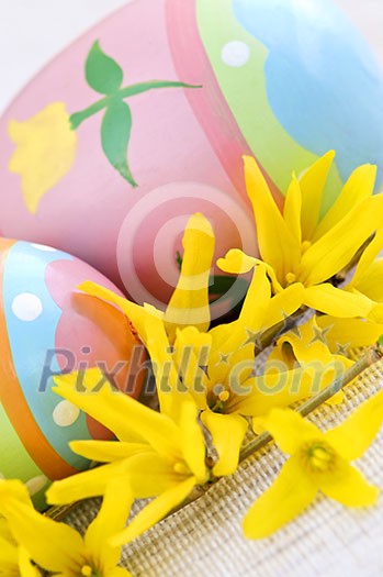 Easter eggs arrangement with yellow forsythia flowers Easter eggs arrangement with yellow forsythia flowers