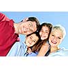 Portrait of happy family of four smiling