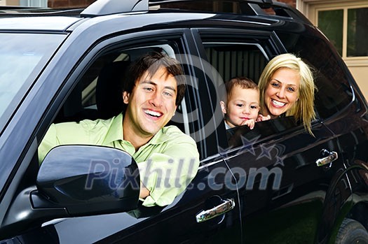 Happy young family sitting in black car looking out windows Happy young family sitting in black car looking out windows