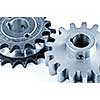 Interlocking industrial metal gears isolated on white