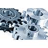 Interlocking industrial metal gears isolated on white