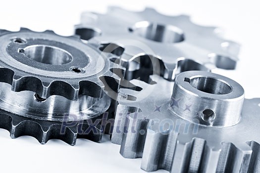 Interlocking industrial metal gears isolated on white Interlocking industrial metal gears isolated on white