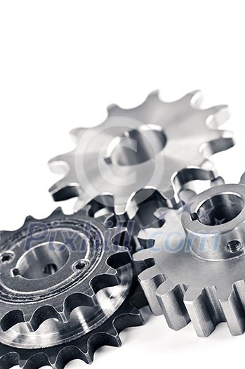 Interlocking industrial metal gears isolated on white Interlocking industrial metal gears isolated on white