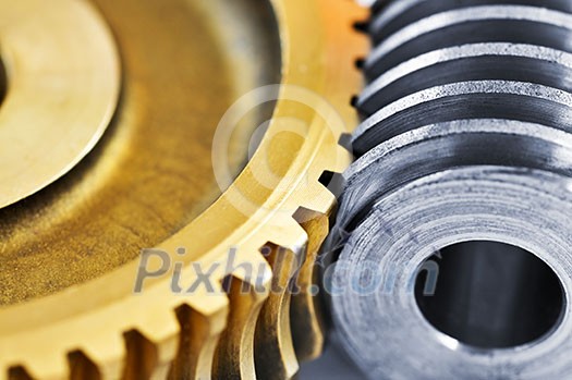 Industrial metal gears and machine parts connected Industrial metal gears and machine parts connected