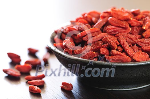 Full bowl of red dried goji berries Full bowl of red dried goji berries