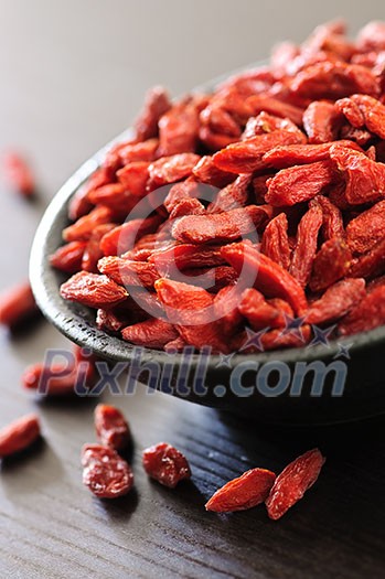 Full bowl of red dried goji berries Full bowl of red dried goji berries