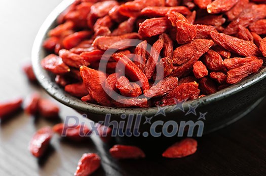Full bowl of red dried goji berries Full bowl of red dried goji berries